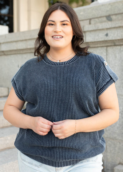 Plus size short sleeve navy knit sweater with a button on the sleeves