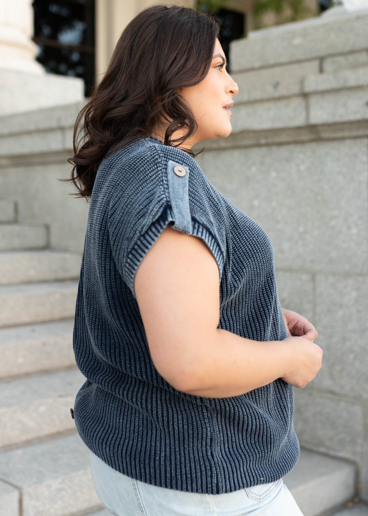 Side view of the navy knit sweater in plus size with short sleeves