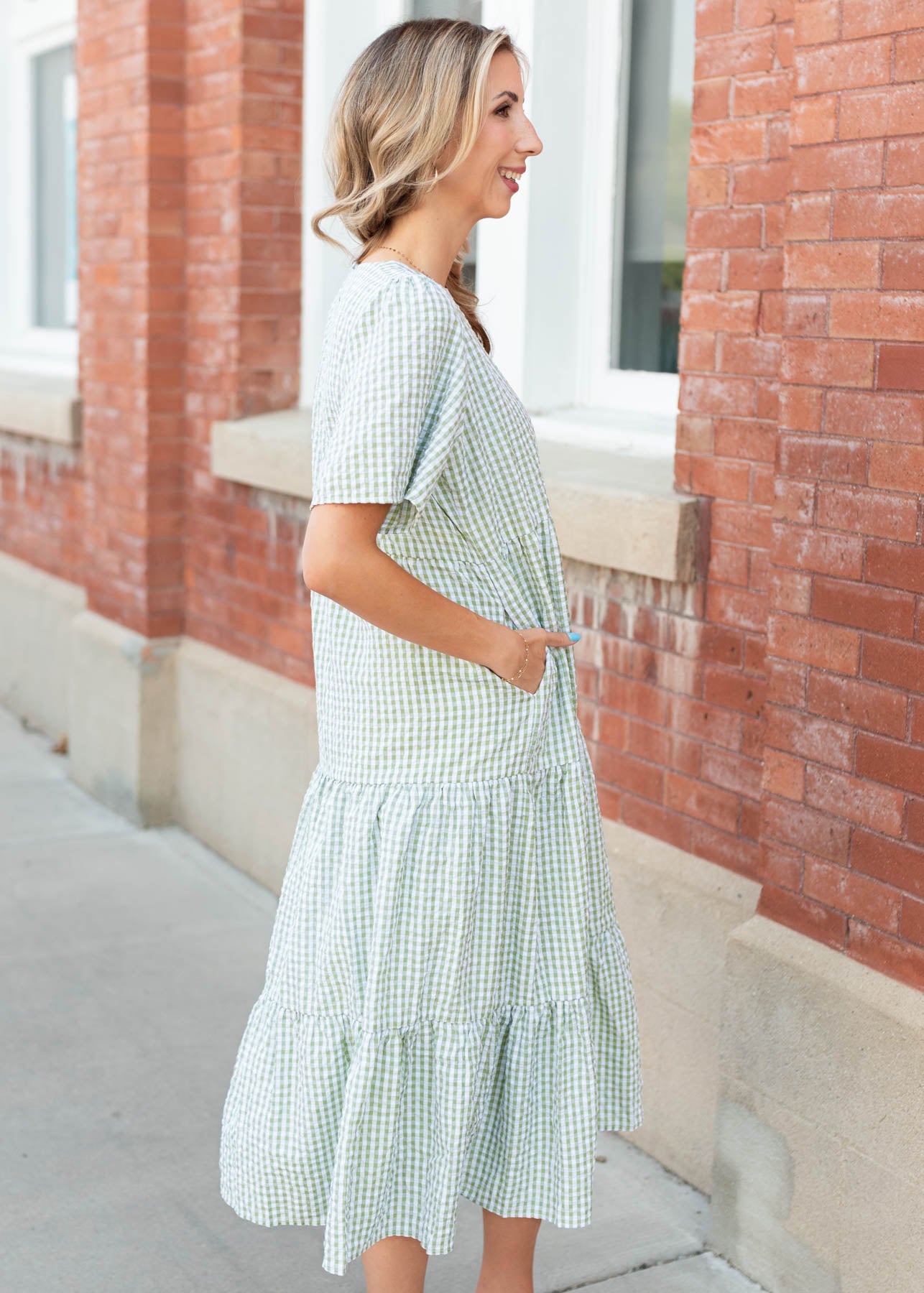 Side view of the sage gingham dress