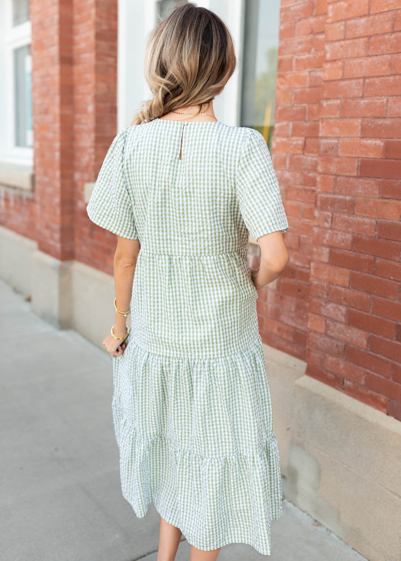 Back view of the sage gingham dress