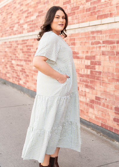 Side view of the modest plus size sage gingham dress with pockets