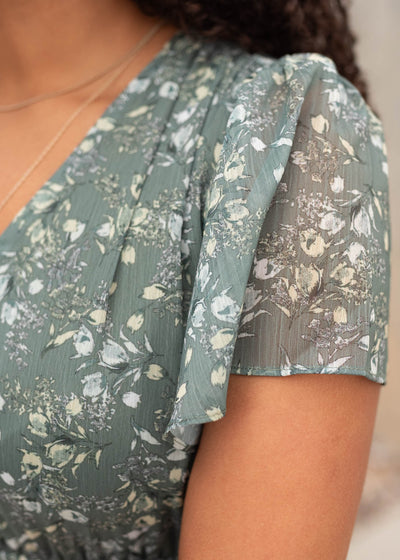 Close up of the sleeve and fabic on the sage floral dress
