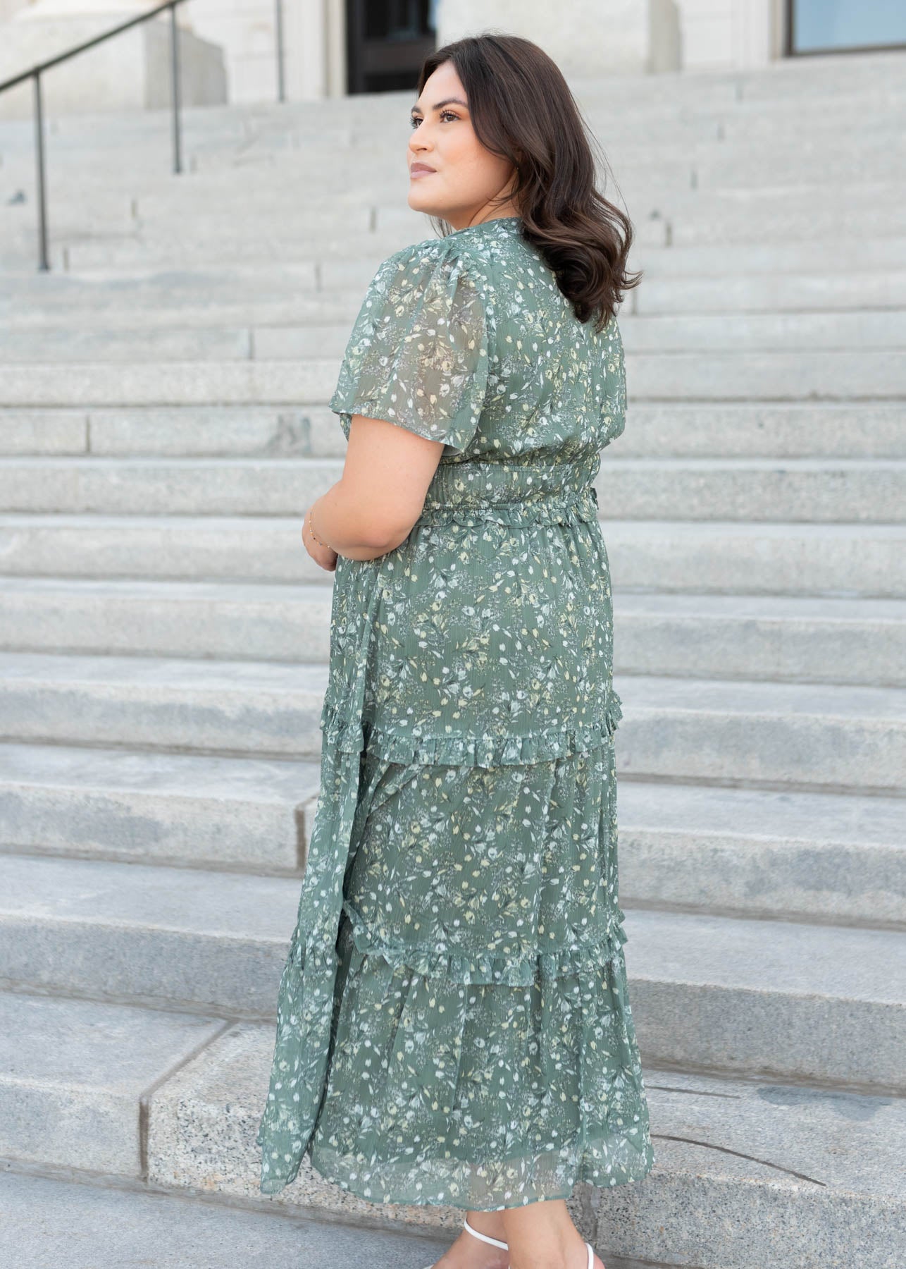 Side view of the sage floral dress with short sleeves in plus size