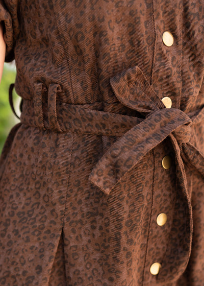 Close up of the tie at the waist on the brown leopard dress
