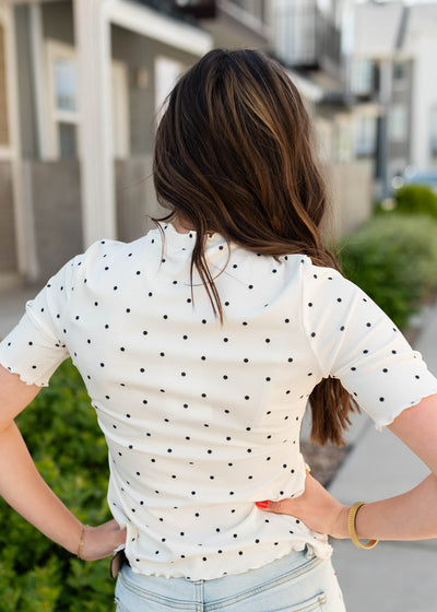 Back view of the cream polka dot ribbed top