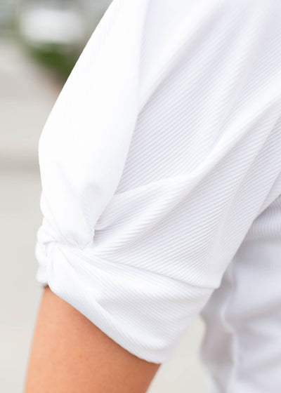 Close up of the sleeve on the white puff sleeve top