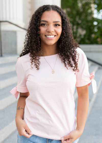 Short sleeve pink bow top with bows on the sleeves