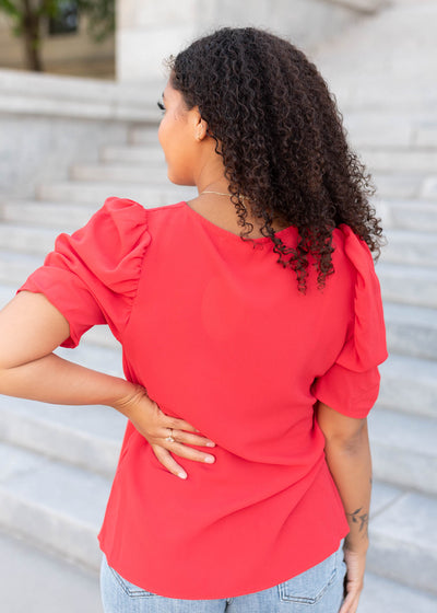 Back view of the red puff sleeve top