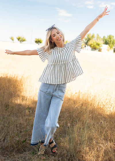 Black and white striped peplum top
