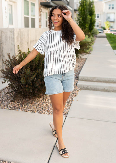 Modest white and black striped peplum top