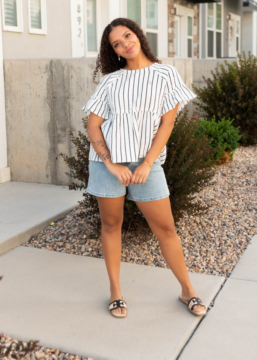 Modest black striped peplum top with short sleeves