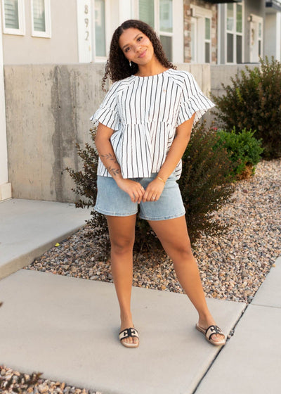 Modest black striped peplum top with short sleeves