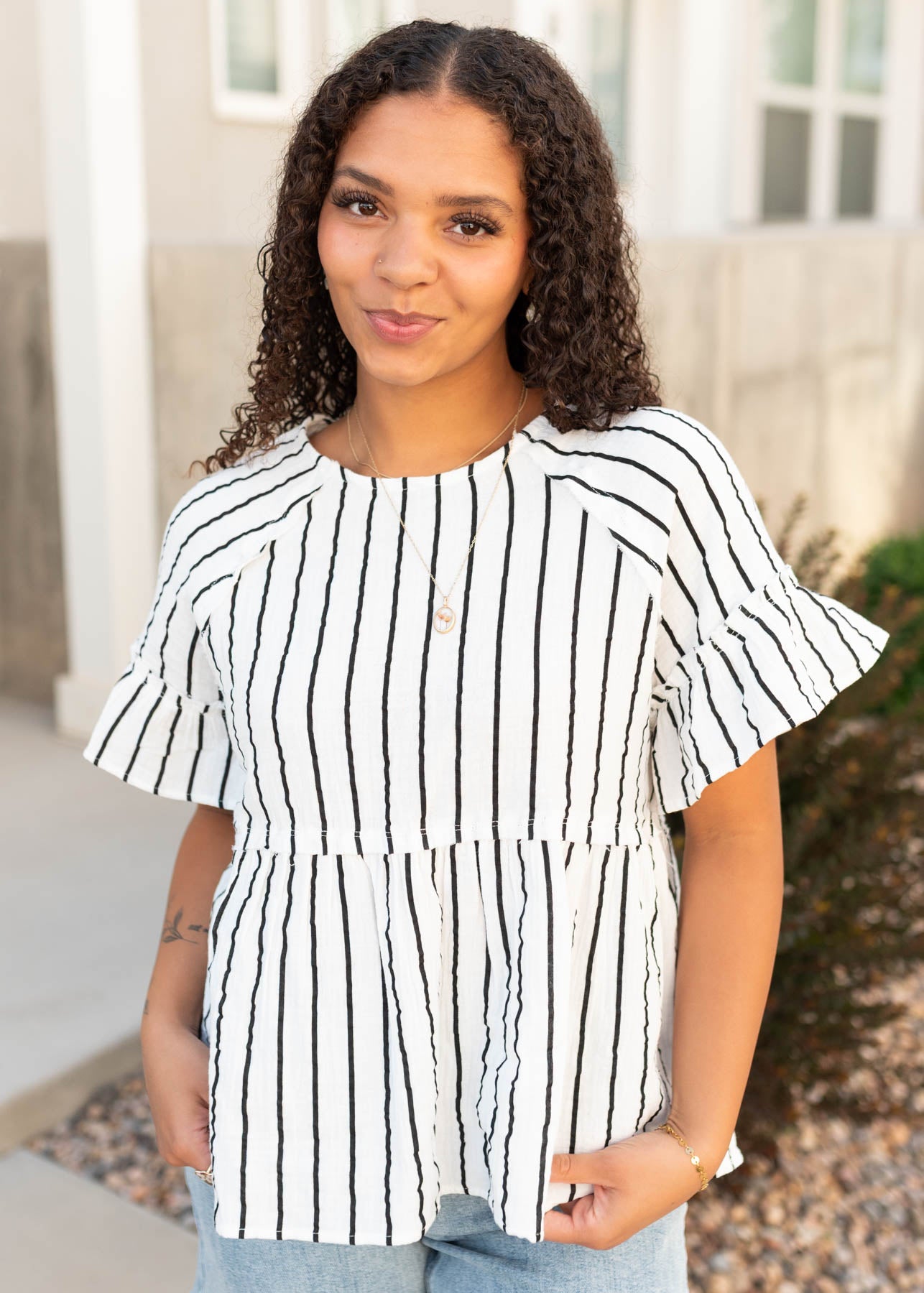 Modest black striped peplum top