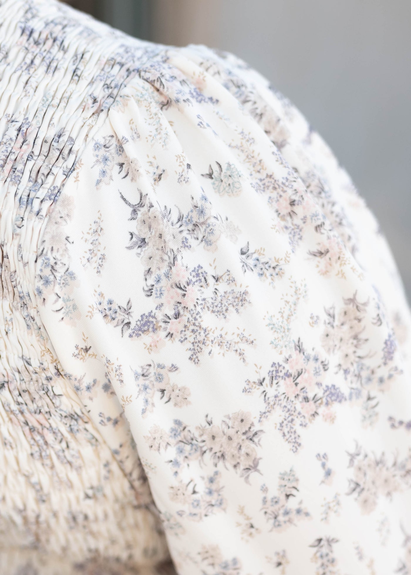 Close up of the fabric on the ivory floral dress