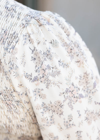 Close up of the fabric on the ivory floral dress