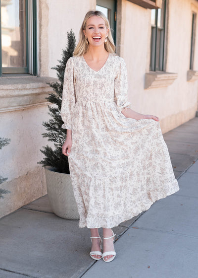 Modest ivory floral dress with long sleeves and smocked bodice