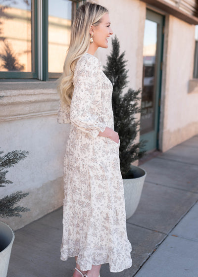 Side view of the ivory floral dress with pockets