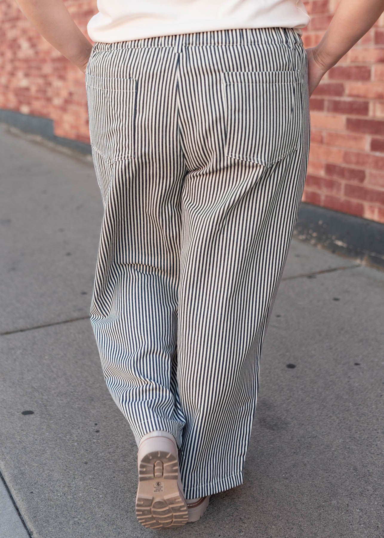 Back view of the plus size navy pinstripe pants