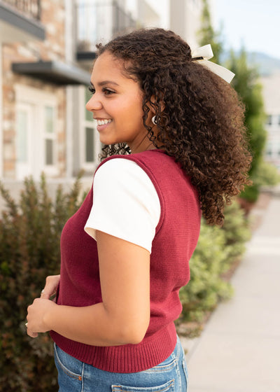 Side view of the burgundy sweater vest at Lena Layne