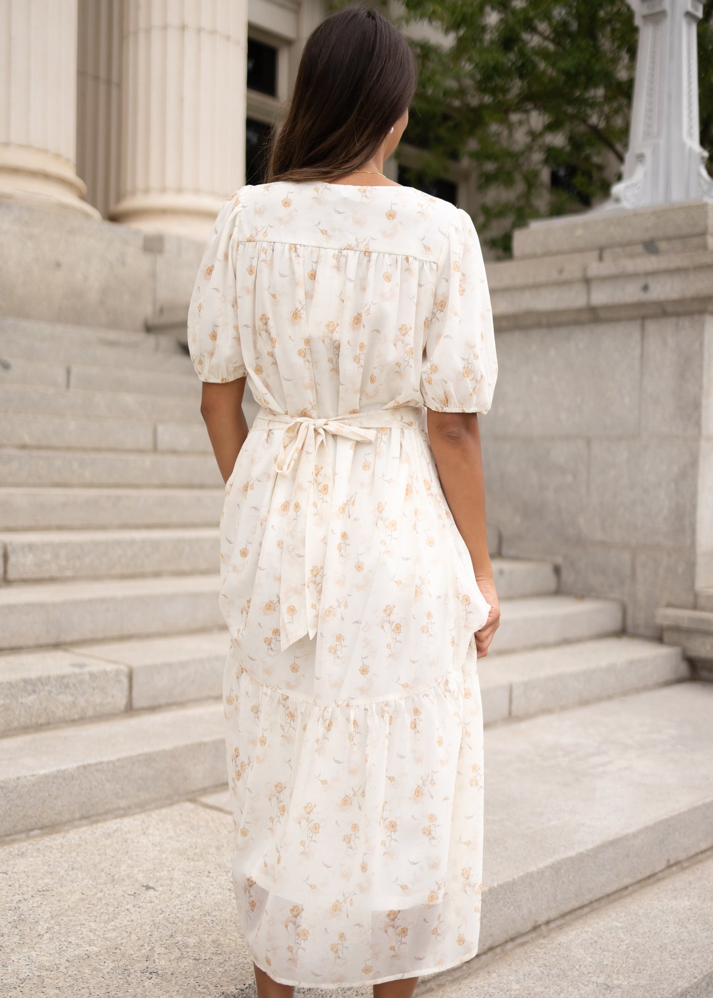 Back view of the cream floral smocked dress