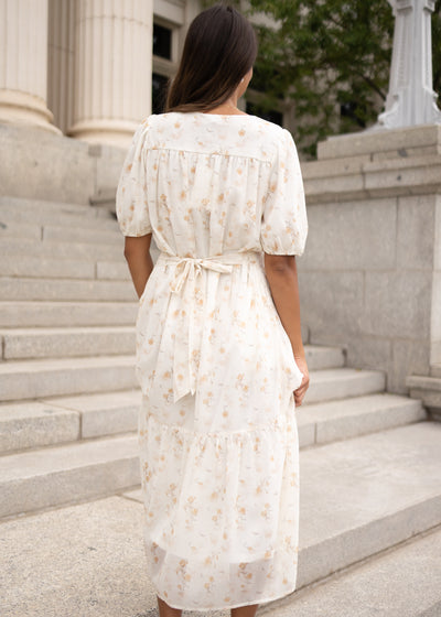 Back view of the cream floral smocked dress