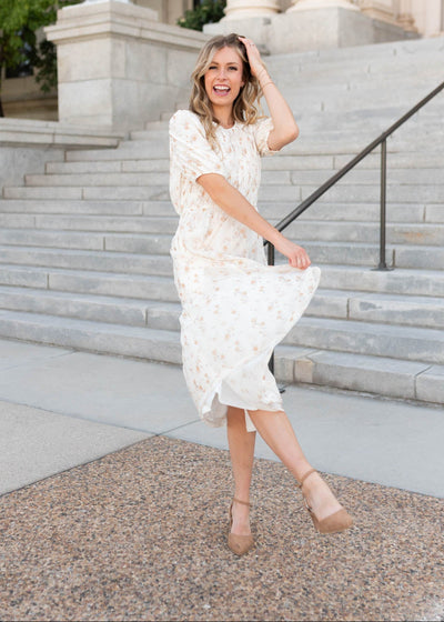 Modest cream floral smocked dress with short sleeves sold exclusively at Lena Layne