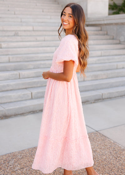 Side view of the pink floral texutred dress