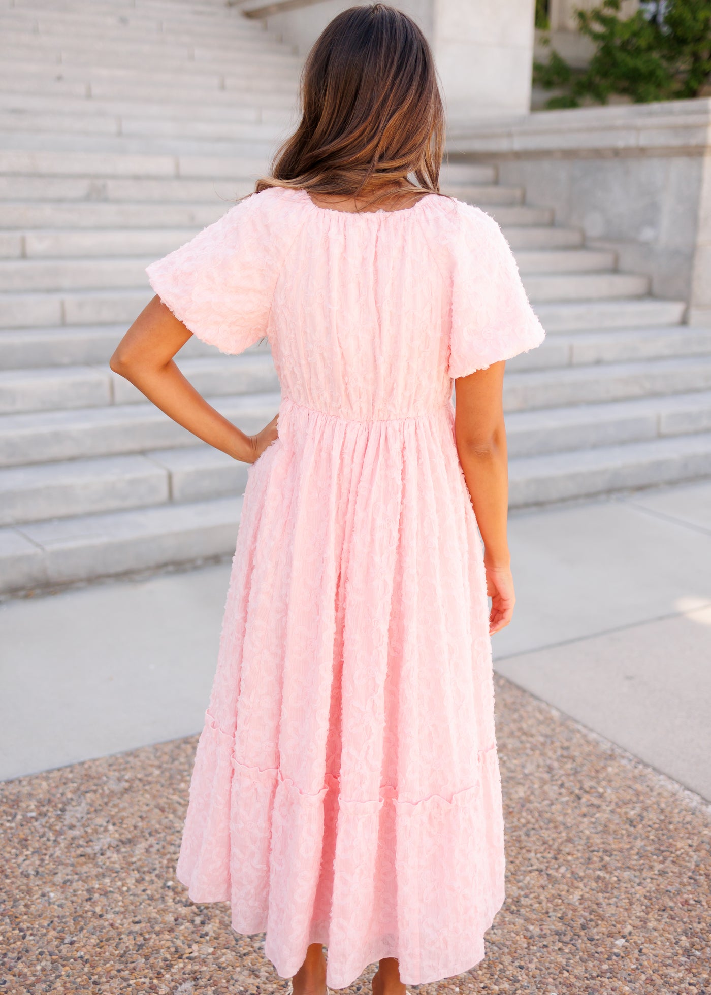 Back view of the pink floral textured dress