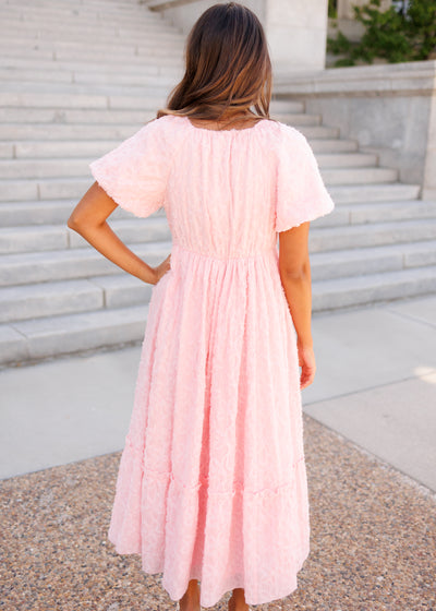 Back view of the pink floral textured dress