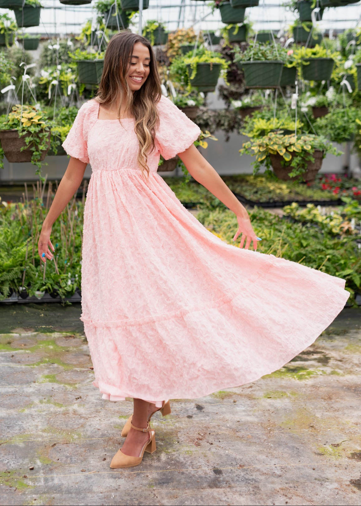 Pink floral textured dress with wide ruffle on the hem