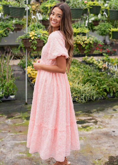 Side view of the pink floral textured dress
