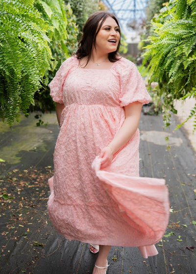 Plus size pink floral textured dress with a square neck