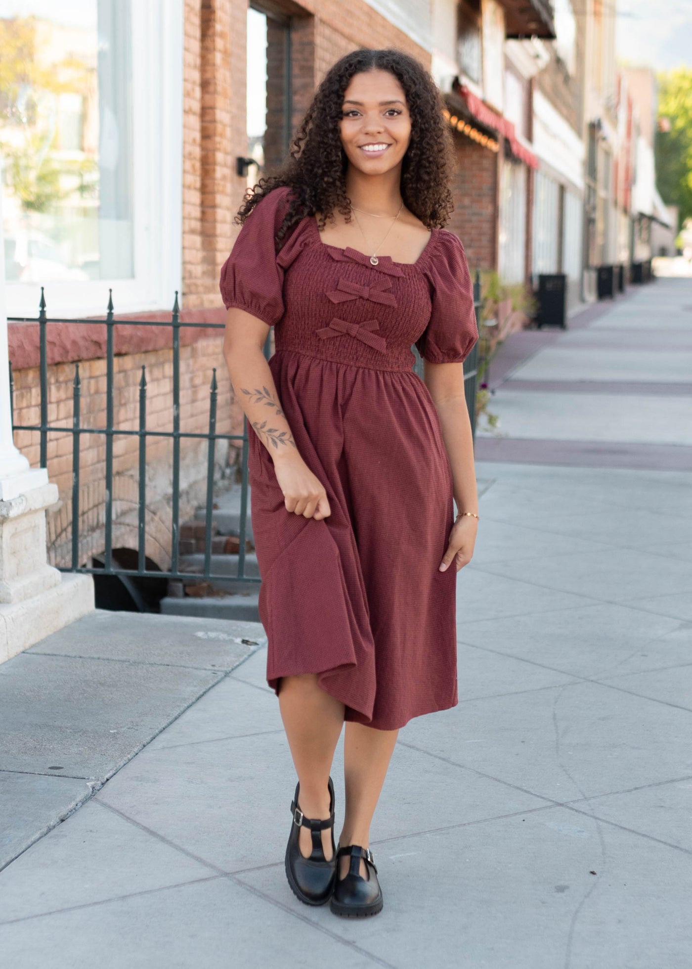 Modest brick gingham bow dress with a smocked bodice