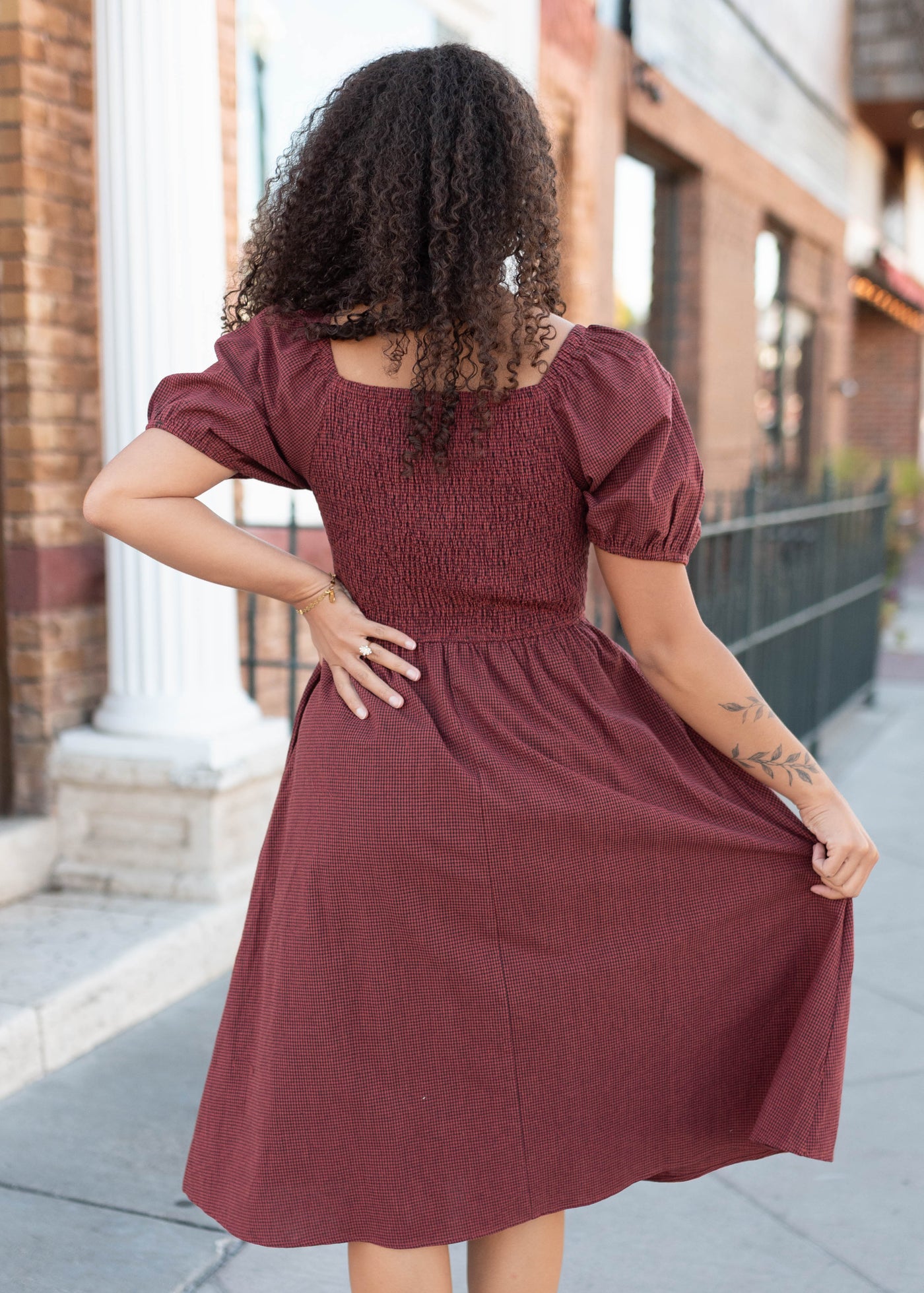 Back view of the brick gingham bow dress
