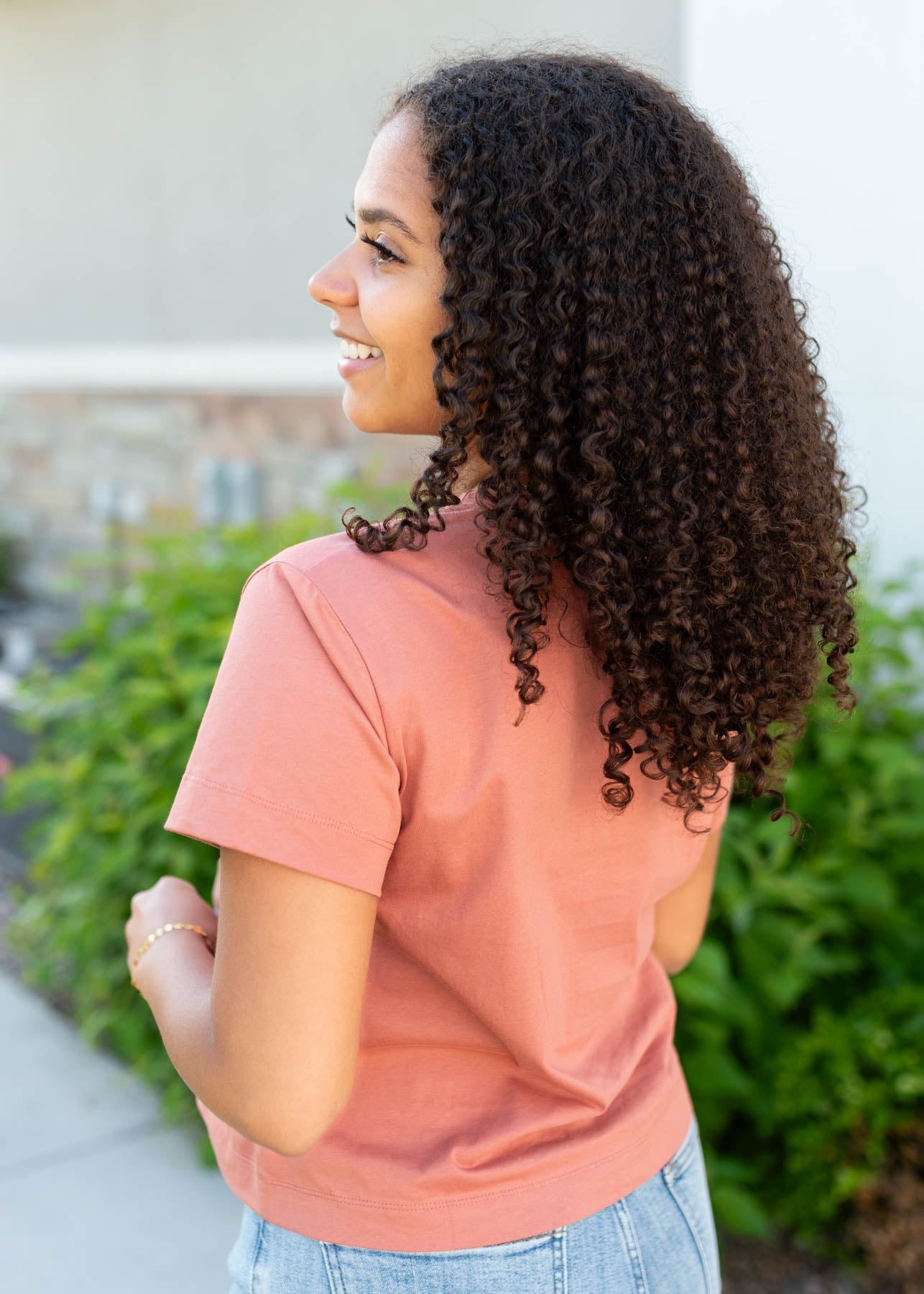 Side view of the terracotta cowgirl tee