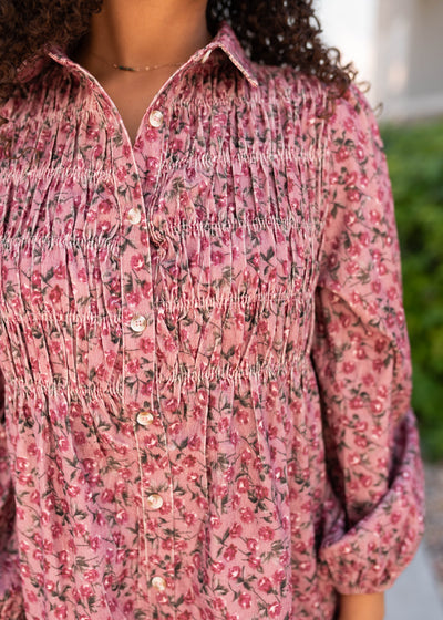 Close up of the smocking on the pink floral dress