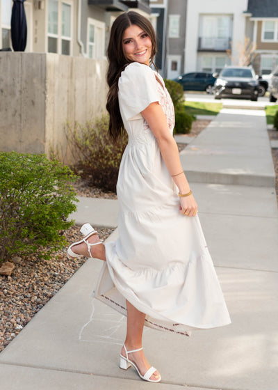 Side view of the short sleeve natural embroidered dress