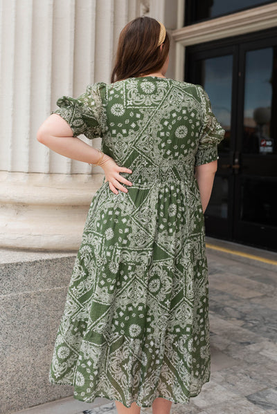 Back view of the plus size green floral tiered dress
