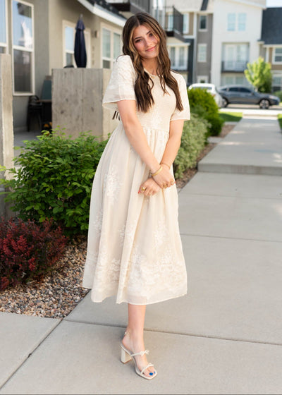 Smocked bodice on the champagne embroidered dress