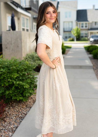 Side view of the champagne embroidered dress