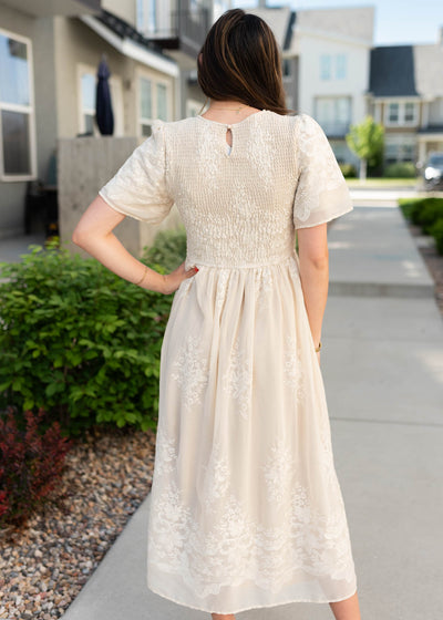 Back view of the champagne embroidered dress