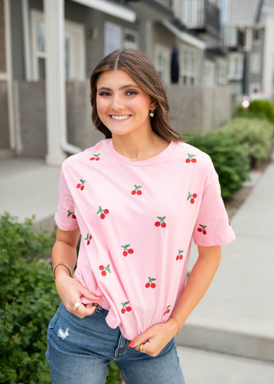 Pink embroidered top with short sleeves