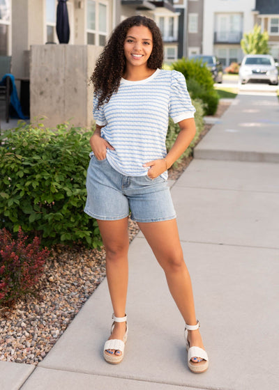 Light blue striped top with white trim