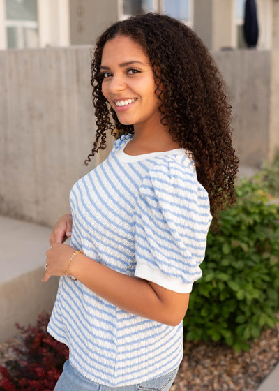 Side view of the light blue striped top