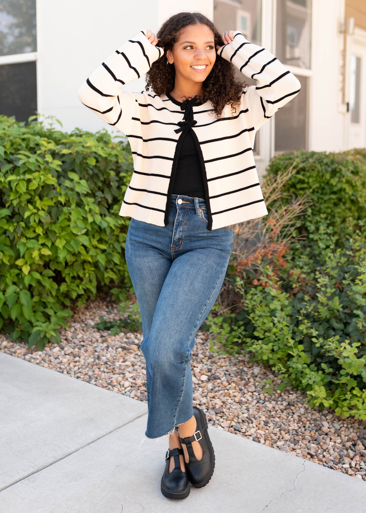 Long sleeve ivory blacks striped cardigan with black bows