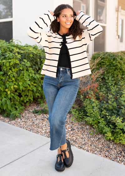 Long sleeve ivory blacks striped cardigan with black bows