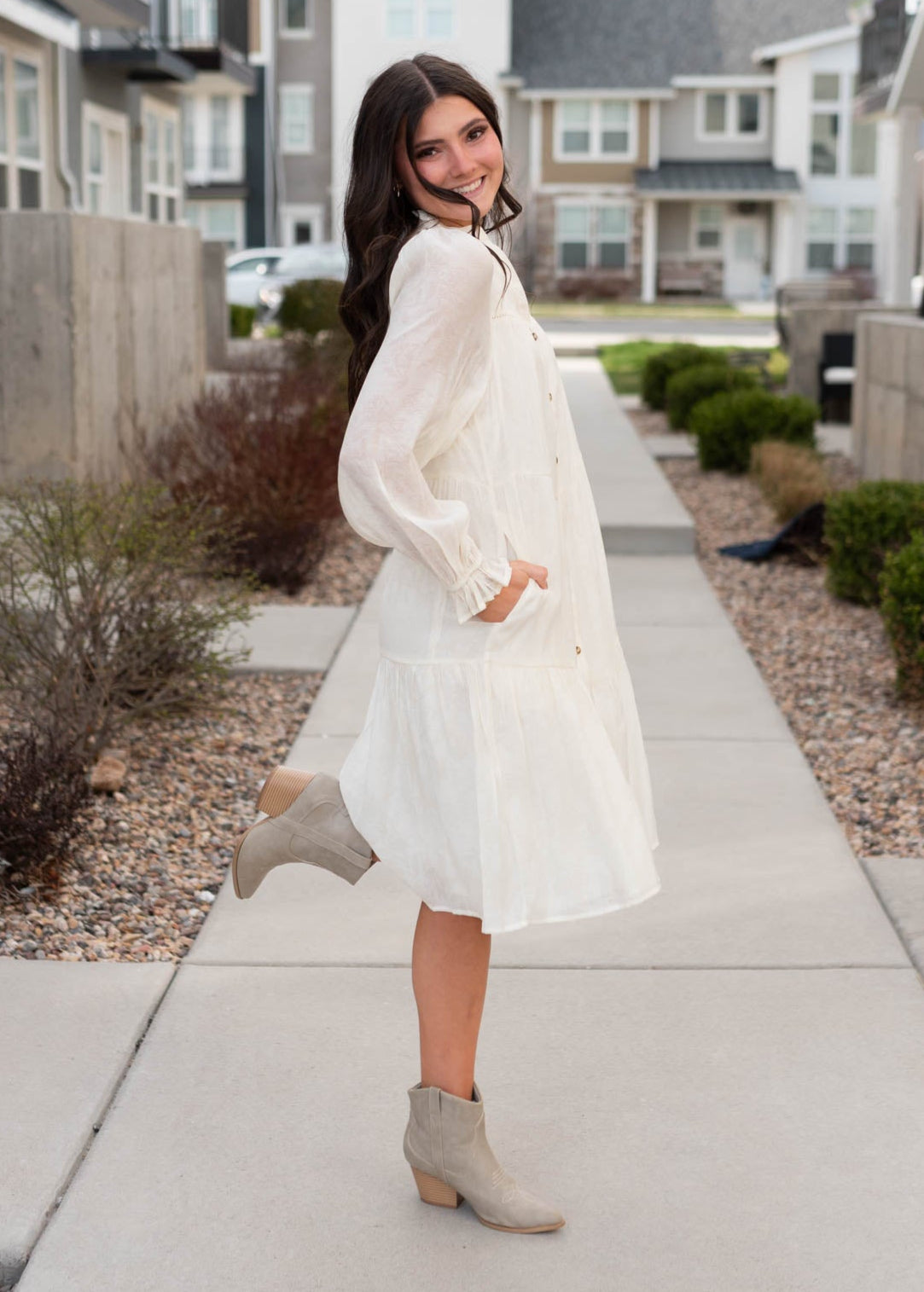 Side view of the ivory button down dress