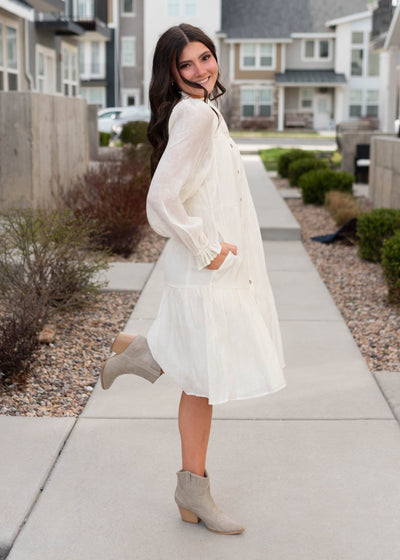Side view of the ivory button down dress