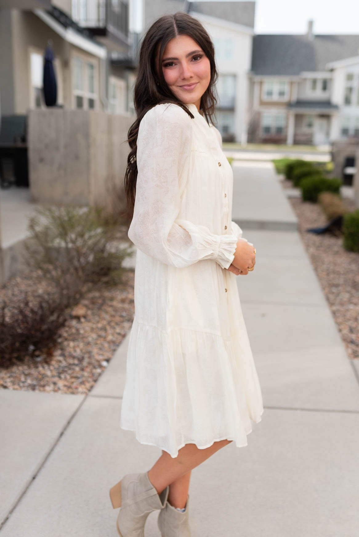 Side view of the ivory button down dress