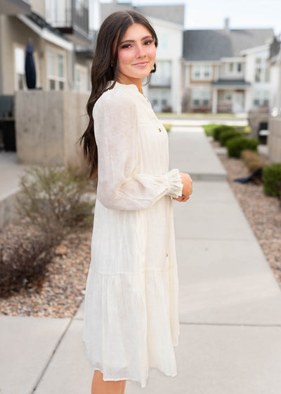Side view of the ivory button down dress